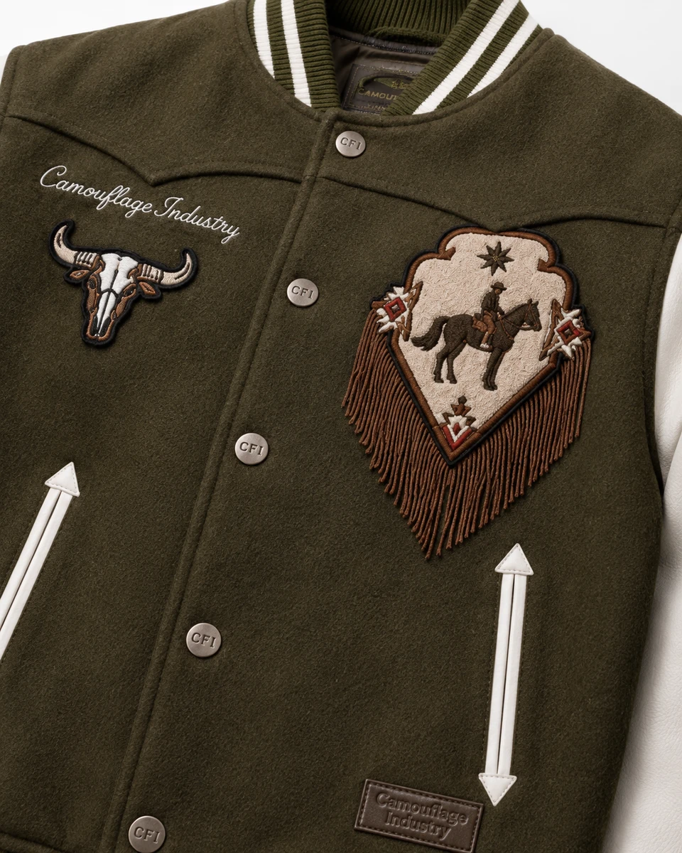 Close-up of embroidery, stitching, fabric, and ribbed details on custom varsity jacket